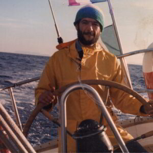 Gianni Ferrandu steering sailboat during Atlantic crossing, expanding yacht technical experience later applied in Costa Smeralda