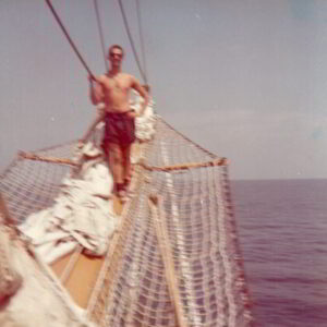 Young Gianni aboard training vessel Palinuro, developing sailing skills essential for future yacht maintenance expertise in Sardinia