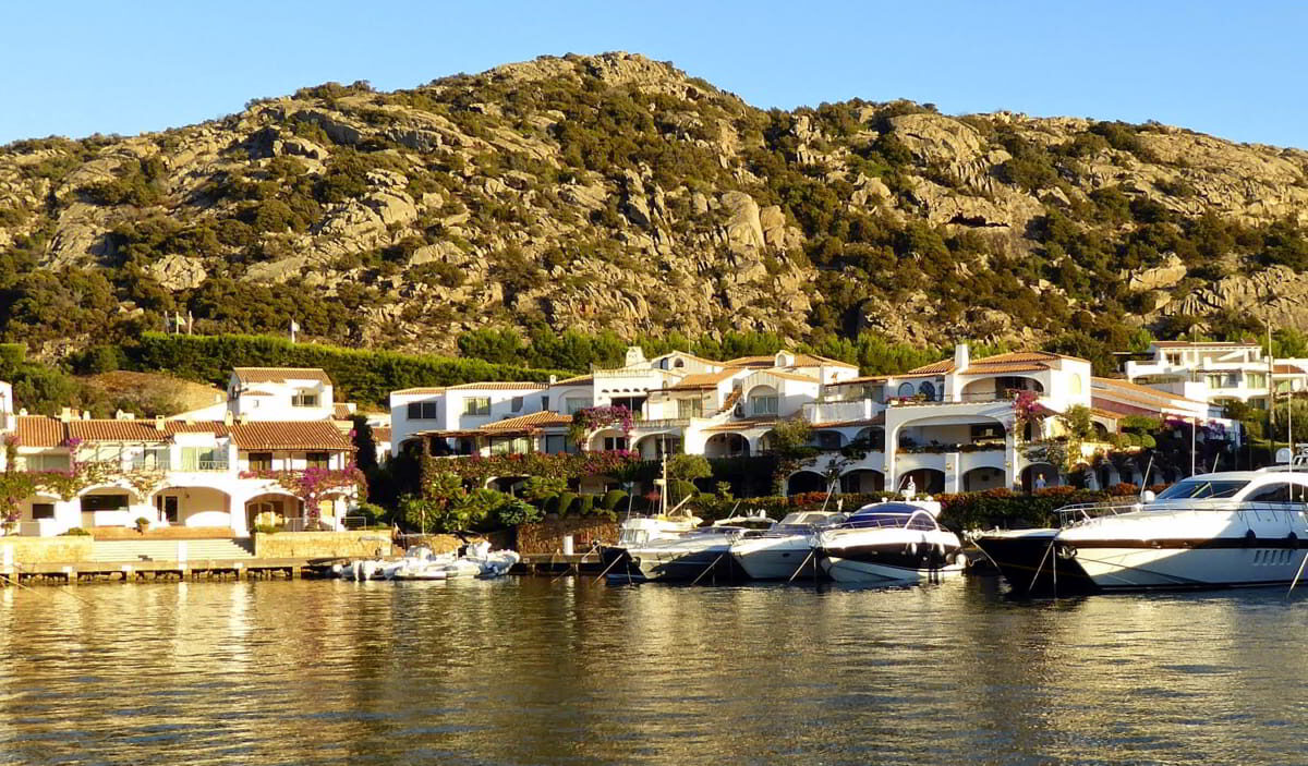 Poltu Quatu yacht berths surrounded by Mediterranean architecture and calm waters along Sardinia’s Emerald Coast