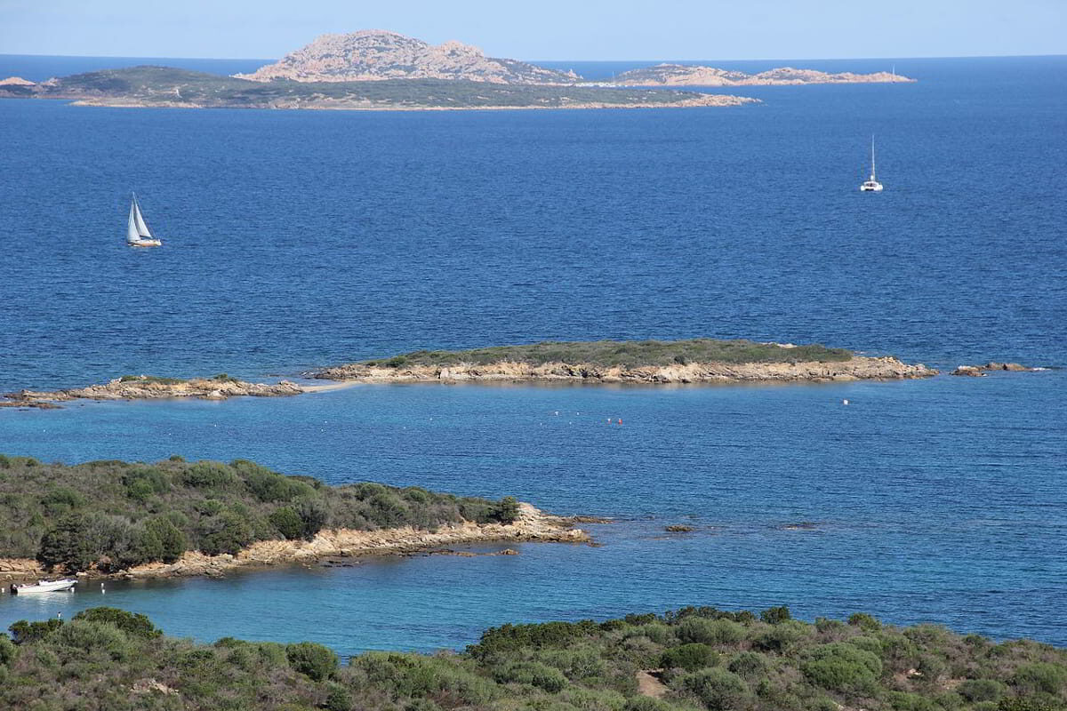 Marina di Portisco with yachts along the sheltered coastline in Costa Smeralda, Sardinia