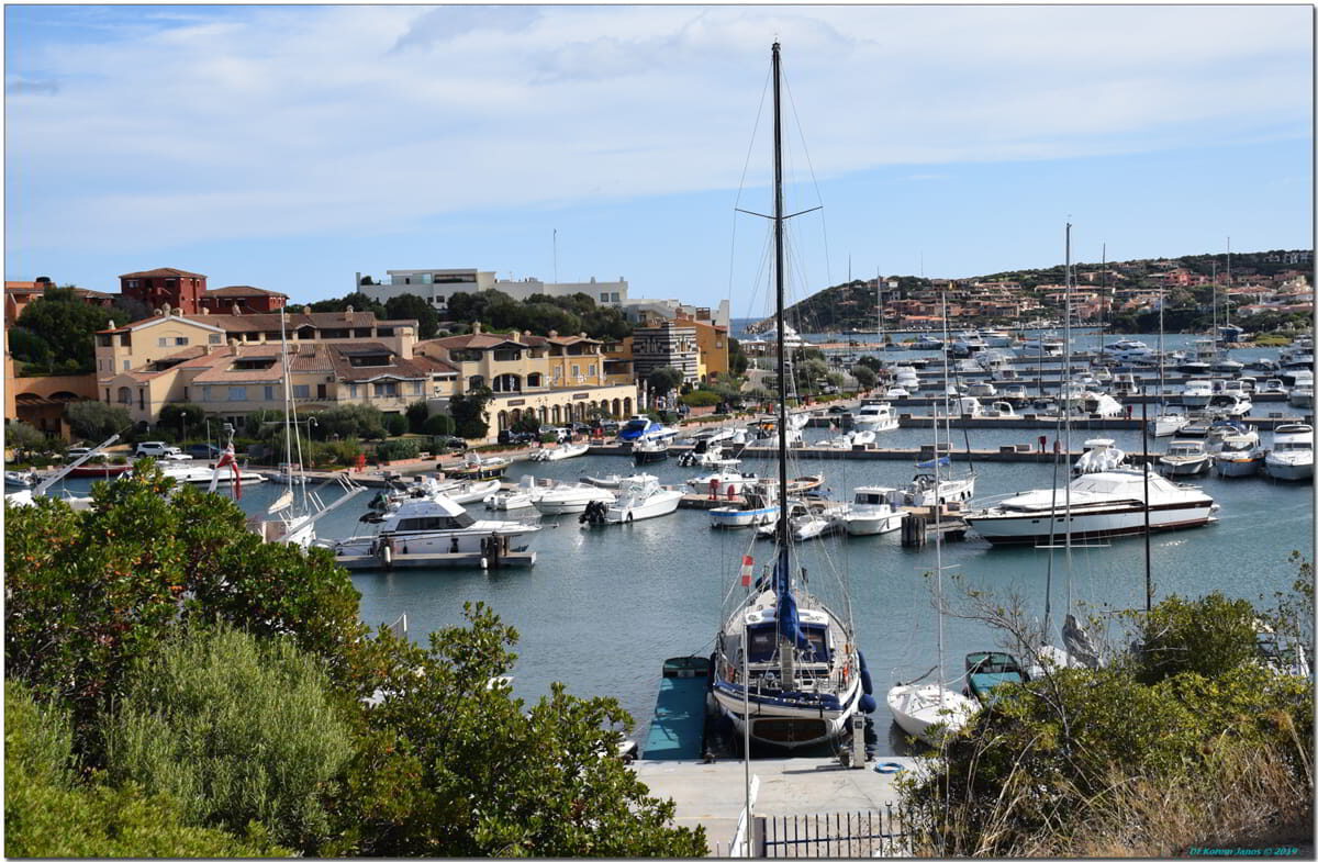 Panoramic view of Porto Cervo marina with boats and waterfront buildings in Northern Sardinia's Costa Smeralda
