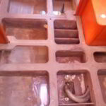 Yacht bilge being vacuumed and sanitized during deep cleaning process