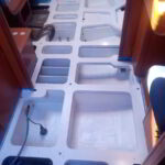 Yacht bilge being vacuumed and sanitized during deep cleaning process