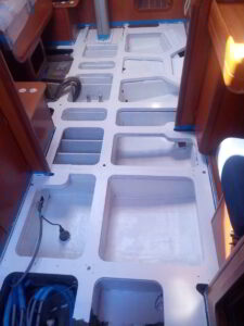 Yacht bilge being vacuumed and sanitized during deep cleaning process