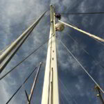 Yacht rigging system being inspected and renewed by technician in Costa Smeralda marina