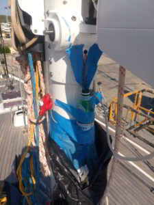 Detailed view of deck hardware components being maintained on sailing yacht in Marina di Olbia