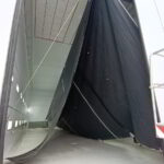 Cleaned yacht sails drying after washing service in Poltu Quatu, Sardinia