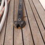 Close-up of sailing hardware maintenance on a yacht deck in Porto Cervo