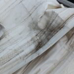 Repairing a yacht sail at Golfo Aranci