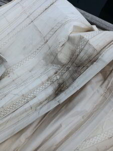 Repairing a yacht sail at Golfo Aranci