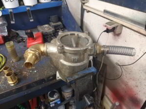 Yacht engineer servicing sea water filter in Porto Marana