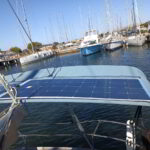 Solar panels being installed on a yacht flybridge in Poltu Quatu under Sardinian sun