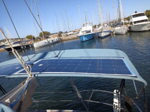 Solar panels being installed on a yacht flybridge in Poltu Quatu under Sardinian sun