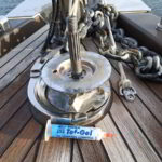 Yacht technician repairing anchor windlass system on luxury yacht in Porto Rotondo