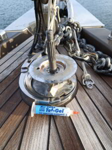 Yacht technician repairing anchor windlass system on luxury yacht in Porto Rotondo
